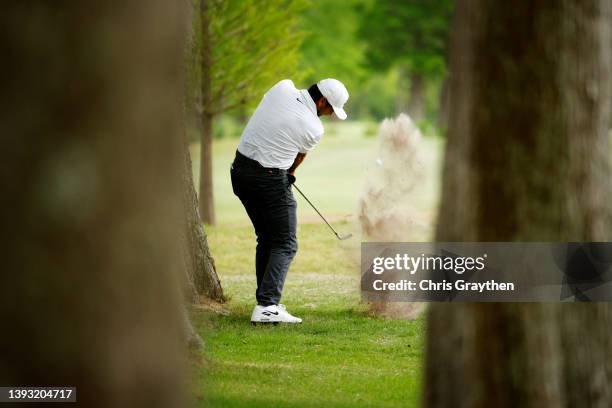 Jason Day of Australia plays a shot from a bunker on the 12th hole during the third round of the Zurich Classic of New Orleans at TPC Louisiana on...