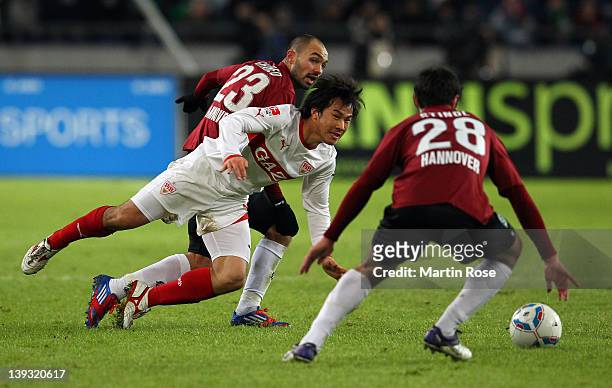 Sofian Chahed of Hannover and Shinji Okazaki of Stuttgart battle for the ball during the Bundesliga match between Hannover 96 and VfB Stuttgart at...