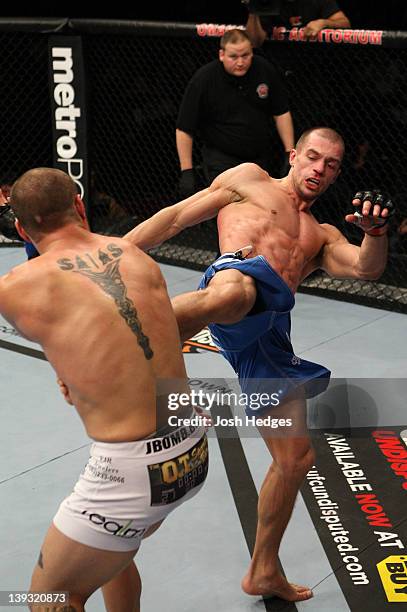 Anton Kuivanen kicks Justin Salas during the UFC on FUEL TV event at Omaha Civic Auditorium on February 15, 2012 in Omaha, Nebraska.