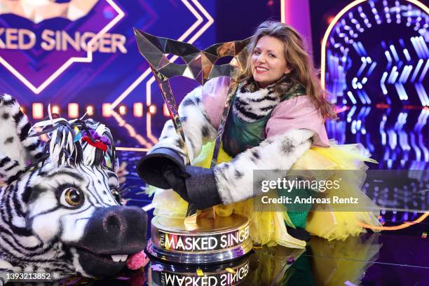 Winner Ella Endlich aka "Das Zebra" poses with her trophy after the finals of the 6th season of "The Masked Singer" at MMC Studios on April 23, 2022...