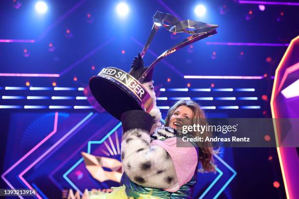 Winner Ella Endlich aka "Das Zebra" poses with her trophy after the finals of the 6th season of "The Masked Singer" at MMC Studios on April 23, 2022...