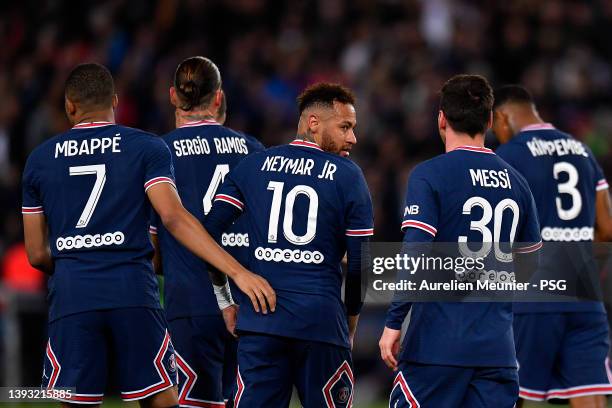 Leo Messi of Paris Saint-Germain is congratulated by Kylian Mbappe and Neymar Jr after scoring during the Ligue 1 Uber Eats match between Paris Saint...