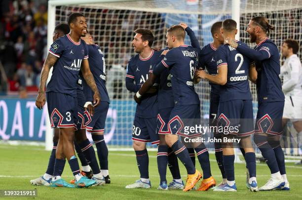 Lionel Messi of PSG celebrates his goal with Presnel Kimpembe and teammates during the Ligue 1 Uber Eats match between Paris Saint-Germain and RC...
