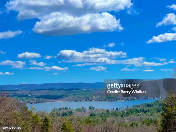 clouds in blue sky above lake and hills, lenox - lenox massachusetts stock pictures, royalty-free photos & images