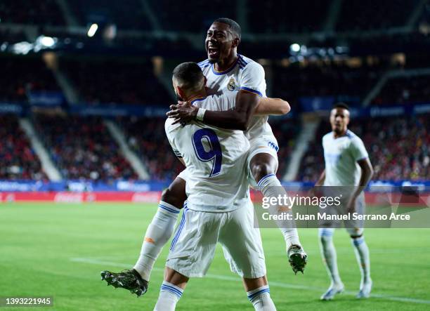 David Alaba of Real Madrid celebrates with his teammate Karim Benzema of of Real Madrid after scoring the opening goal during the LaLiga Santander...