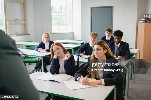 teenage schoolgirl in wheelchair raising hand to talk - schoolboy stock pictures, royalty-free photos & images
