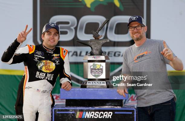 Noah Gragson, driver of the Bass Pro Shops/TrueTimber/BRCC Chevrolet, and team owner Dale Earnhardt Jr. Pose for photos in victory lane after winning...