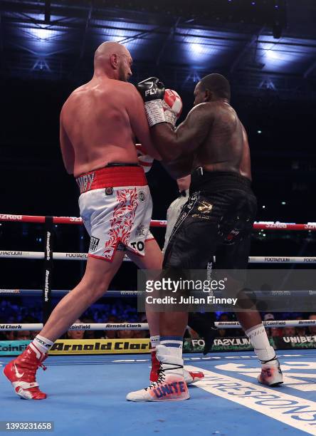 Tyson Fury lands a upper cut shot to knock down Dillian Whyte during the WBC World Heavyweight Title Fight between Tyson Fury and Dillian Whyte at...