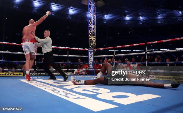 Tyson Fury lands a upper cut shot to knock down Dillian Whyte during the WBC World Heavyweight Title Fight between Tyson Fury and Dillian Whyte at...