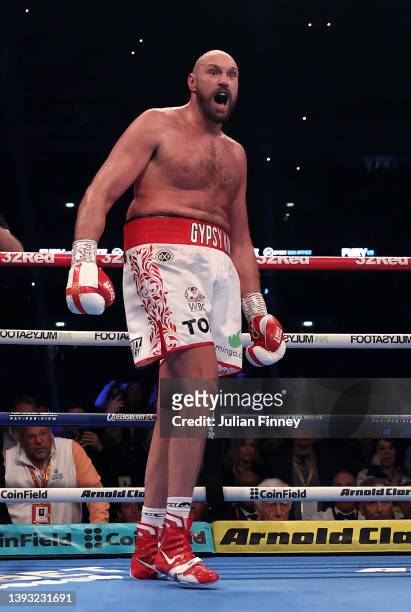 Tyson Fury celebrates after landing a upper cut shot to knock down Dillian Whyte during the WBC World Heavyweight Title Fight between Tyson Fury and...