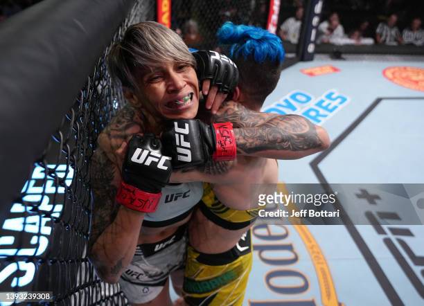 Jessica Andrade of Brazil secures a choke submission against Amanda Lemos of Brazil in a strawweight fight during the UFC Fight Night event at UFC...