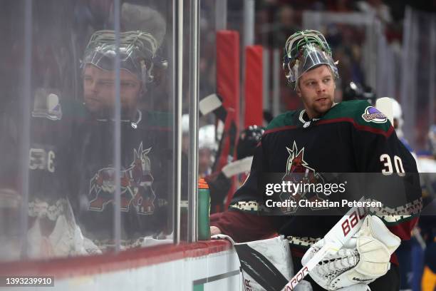Goaltender Harri Sateri of the Arizona Coyotes stands near the bench during a break from the first period of the NHL game against the St. Louis Blues...