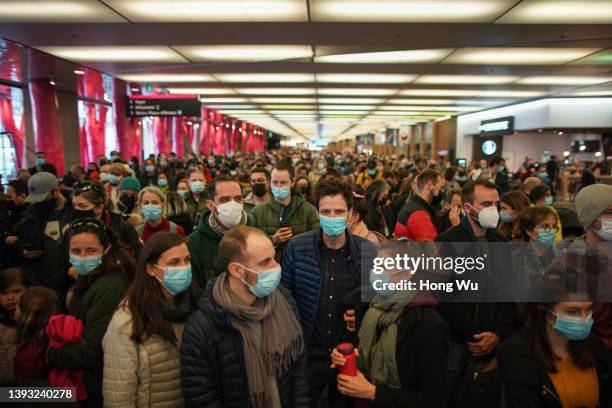 French citizens wait in line to vote in the second round of France's presidential election at the Palais des Congres on April 23, 2022 in Montreal,...