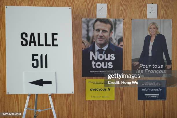 Posters of candidates Emmanuel Macron and Marine Le Pen are seen during the second round of France's presidential election at the Palais des Congres...