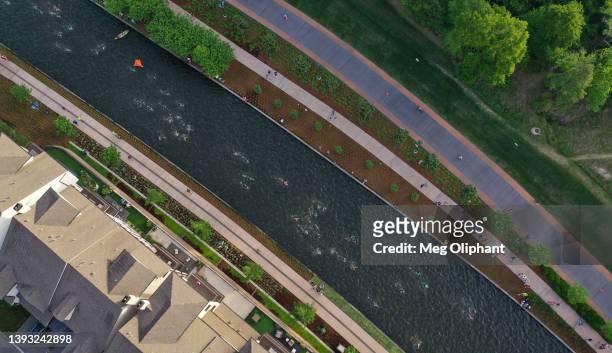 Aerial view of athletes competing in the swim course of the IRONMAN Texas on April 23, 2022 in The Woodlands, Texas.
