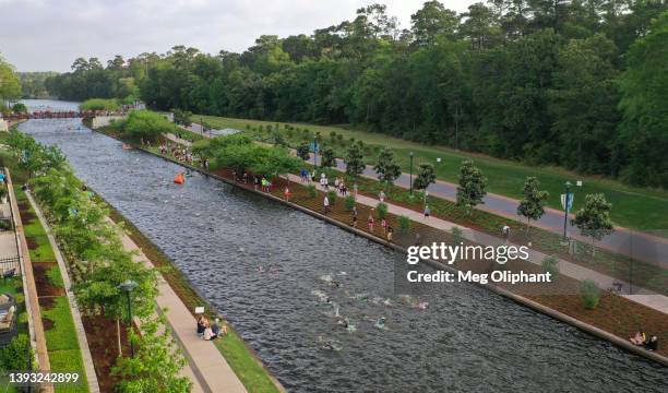 Aerial view of athletes competing in the swim course of the IRONMAN Texas on April 23, 2022 in The Woodlands, Texas.