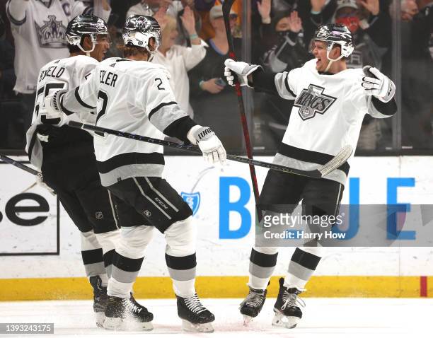 Arthur Kaliyev of the Los Angeles Kings celebrates his goal with Quinton Byfield and Alexander Edler, to take a 1-0 lead over the Anaheim Ducks,...