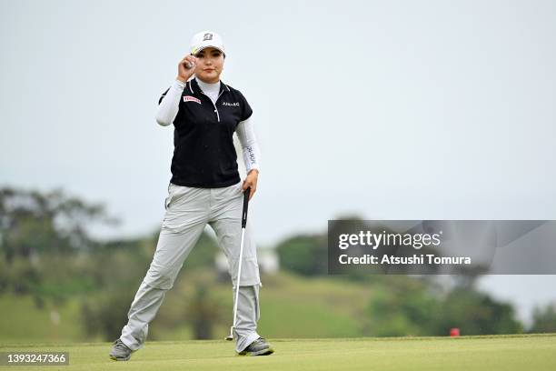 Sayaka Takahashi of Japan acknowledges the gallery after the birdie on the 13th green during the final round of Fuji Sankei Ladies Classic at Kawana...