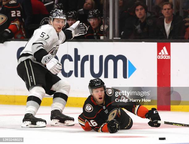 Gerry Mayhew of the Anaheim Ducks plays the puck as he falls to the ice in front of Jacob Moverare of the Los Angeles Kings during the second period...
