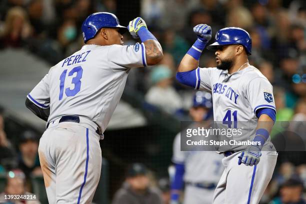 Salvador Perez and Carlos Santana of the Kansas City Royals celebrate a two run home run by Santana during the seventh inning against the Seattle...