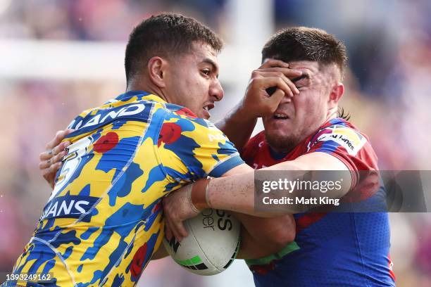 Will Penisini of the Eels is tackled by Bradman Best of the Knights during the round seven NRL match between the Newcastle Knights and the Parramatta...