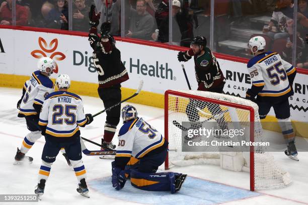 Bokondji Imama of the Arizona Coyotes celebrates with Alex Galchenyuk after scoring his first career goal against goaltender Jordan Binnington of the...