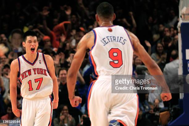Jeremy Lin of the New York Knicks reacts with teammate Jared Jeffries during the game against the Dallas Mavericks at Madison Square Garden on...