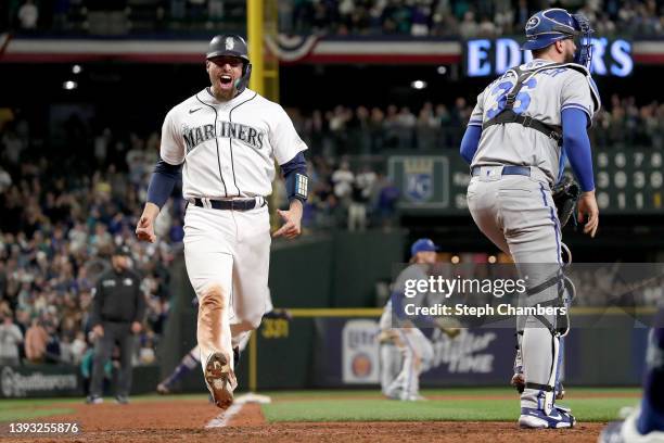 Tom Murphy of the Seattle Mariners scores on a double by Jesse Winker during the eighth inning against the Kansas City Royals at T-Mobile Park on...