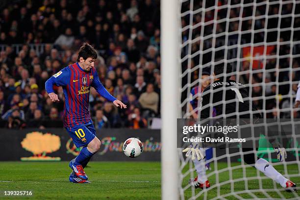 Lionel Messi of FC Barcelona scores his team's first goal during the La Liga match between FC Barcelona and Valencia CF at Camp Nou stadium on...