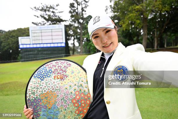 Sayaka Takahashi of Japan imitates the selfie after winning the tournament following the final round of Fuji Sankei Ladies Classic at Kawana Hotel...