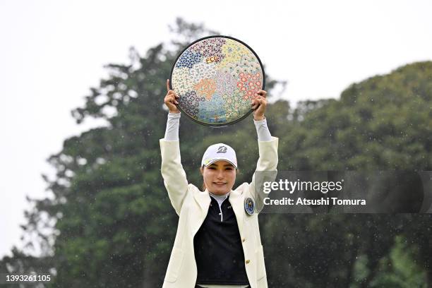 Sayaka Takahashi of Japan poses with the trophy after winning the tournament following the final round of Fuji Sankei Ladies Classic at Kawana Hotel...