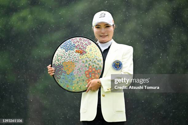 Sayaka Takahashi of Japan poses with the trophy after winning the tournament following the final round of Fuji Sankei Ladies Classic at Kawana Hotel...