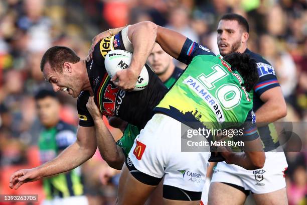 Isaah Yeo of the Panthers is tackled during the round seven NRL match between the Penrith Panthers and the Canberra Raiders at BlueBet Stadium on...