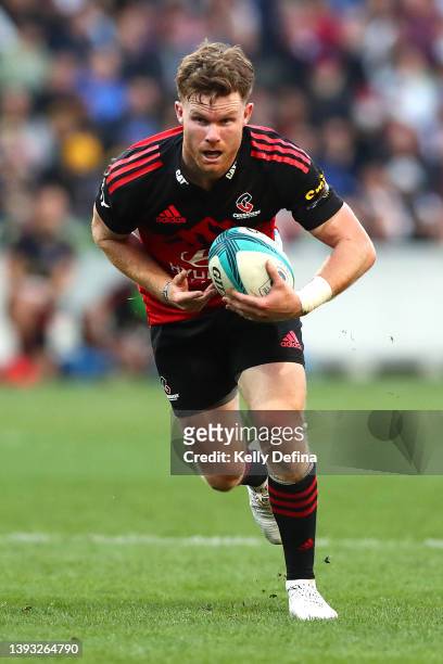 Mitchell Drummond of the Crusaders runs with the ball during the round 10 Super Rugby Pacific match between the Crusaders and the Melbourne Rebels at...