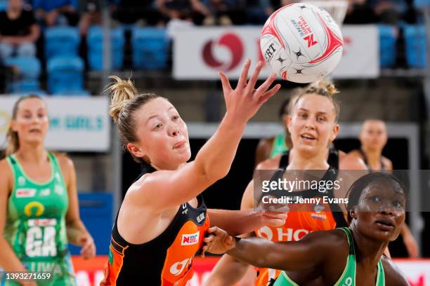 Sophie Dwyer of the Giants jumps for the ball defended by Sunday Aryng during the round six Super Netball match between GWS Giants and West Coast...