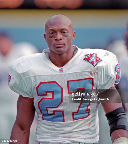 Running back Eddie George of the Tennessee Oilers looks on from the sideline during a game against the Pittsburgh Steelers at Three Rivers Stadium on...