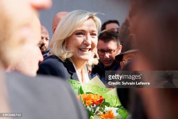 French far-right National Rally candidate Marine Le Pen leaves a polling station after casting her ballot for the 2nd round of the presidential...