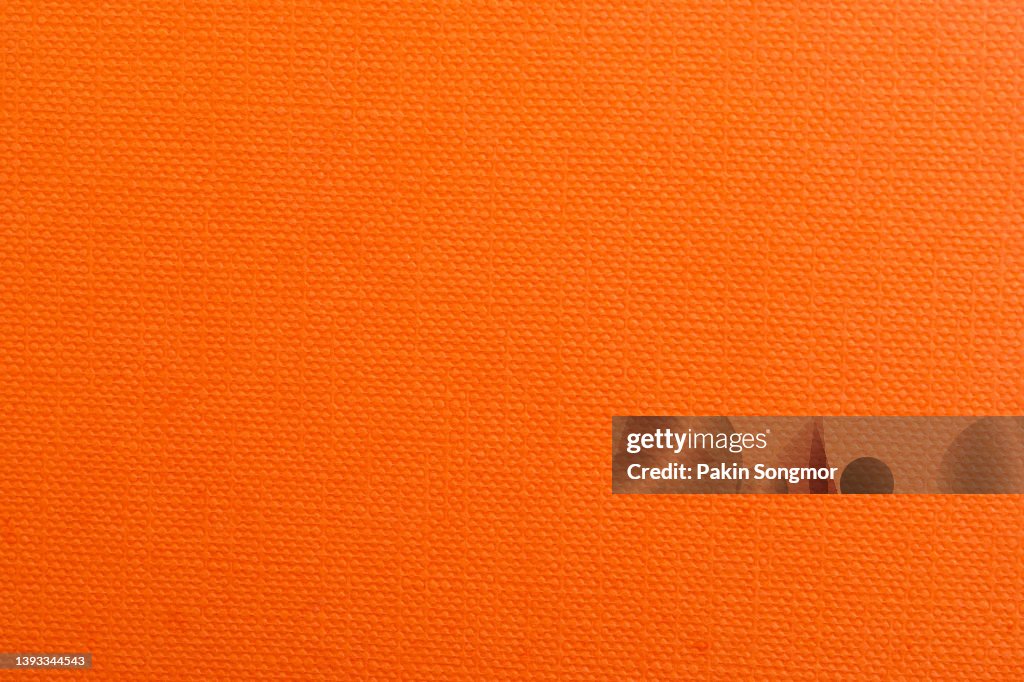 Orange color paper sheet texture cardboard background.