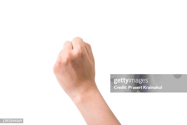 hand fist isolated on white background - woman arm fist stock pictures, royalty-free photos & images