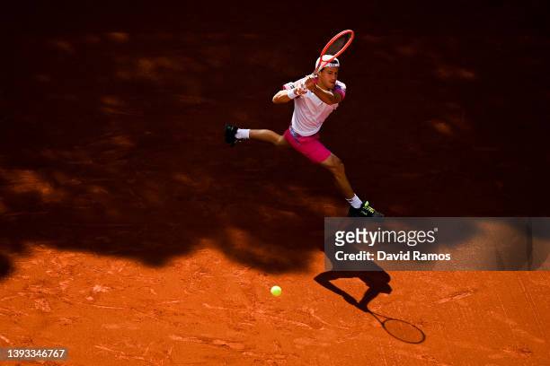 Diego Schwartzman of Argentina plays a backhand during their semifinal match against Pablo Carreño of Spain during Day seven of Barcelona Open Banc...