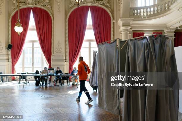 Voter leaves the polling booth of the polling station of townhall on April 24, 2022 in Roubaix, France. Emmanuel Macron and Marine Le Pen were both...