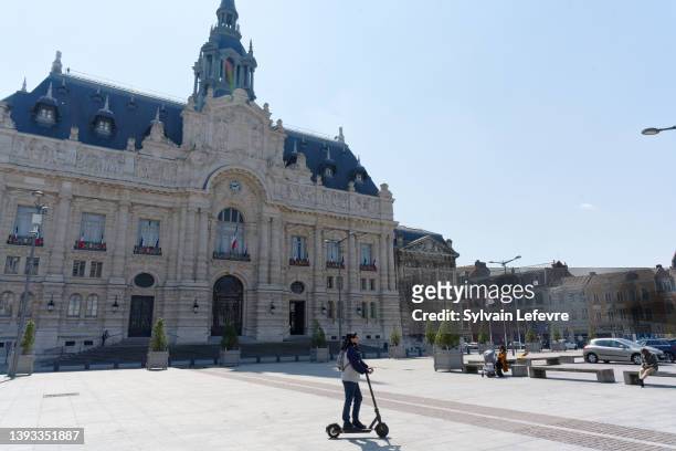 Local residents are seen on the main square on April 24, 2022 in Roubaix, France. Emmanuel Macron and Marine Le Pen were both qualified on Sunday...