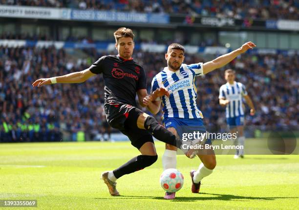 Jan Bednarek of Southampton battles for possession with Neal Maupay of Brighton & Hove Albion during the Premier League match between Brighton & Hove...