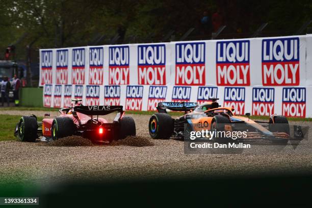 Daniel Ricciardo of Australia driving the McLaren MCL36 Mercedes and Carlos Sainz of Spain driving the Ferrari F1-75 collide at the start during the...