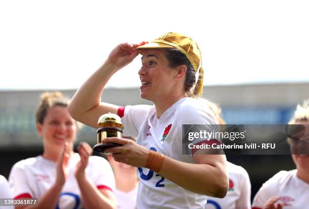 Emily Scarratt of England celebrates after being presented with her 100th Cap after the final whistle of the TikTok Women's Six Nations match between...