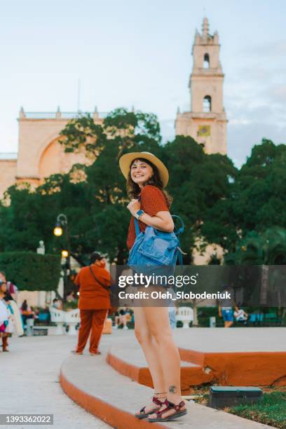 woman walking in merida in mexico - merida mexico stock pictures, royalty-free photos & images