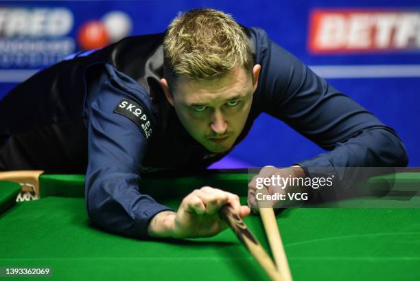 Kyren Wilson of England plays a shot in the second round match against Stuart Bingham of England on day nine of the 2022 Betfred World Snooker...