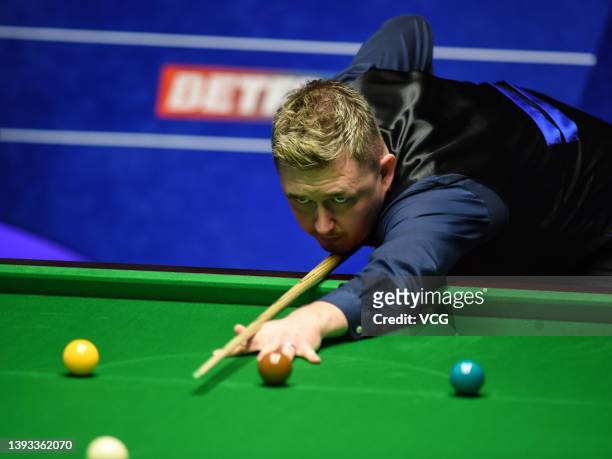 Kyren Wilson of England plays a shot in the second round match against Stuart Bingham of England on day nine of the 2022 Betfred World Snooker...