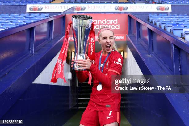 Missy Bo Kearns of Liverpool Women celebrates with the Barclays FA Women's Championship Trophy whilst celebrating their side's promotion to the...