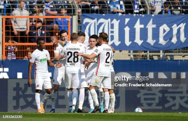 Michael Gregoritsch of FC Augsburg celebrates scoring their side's second goal with teammates during the Bundesliga match between VfL Bochum and FC...